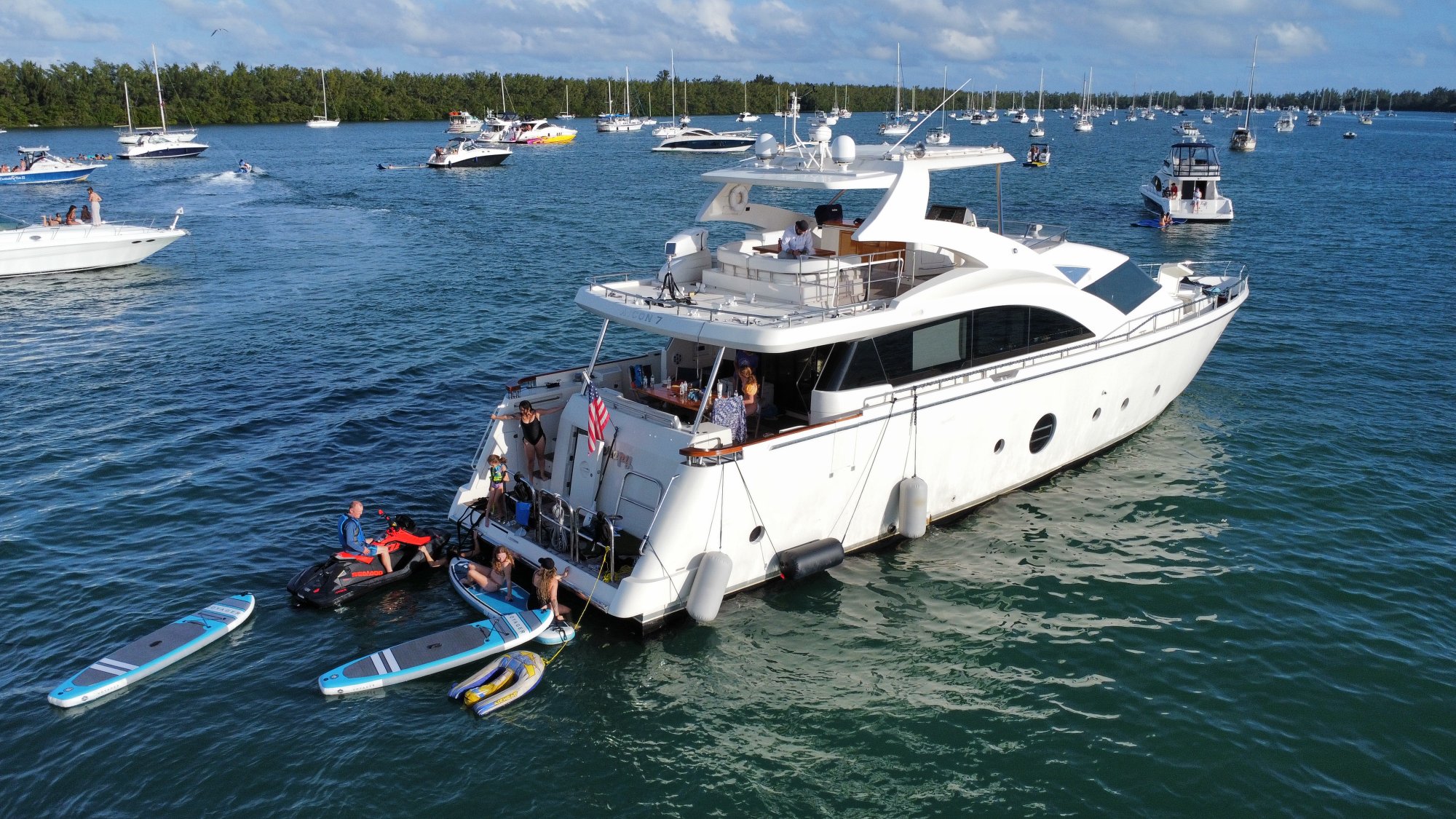 Aicon 75 Therapy anchored with jet ski and paddleboards Miami