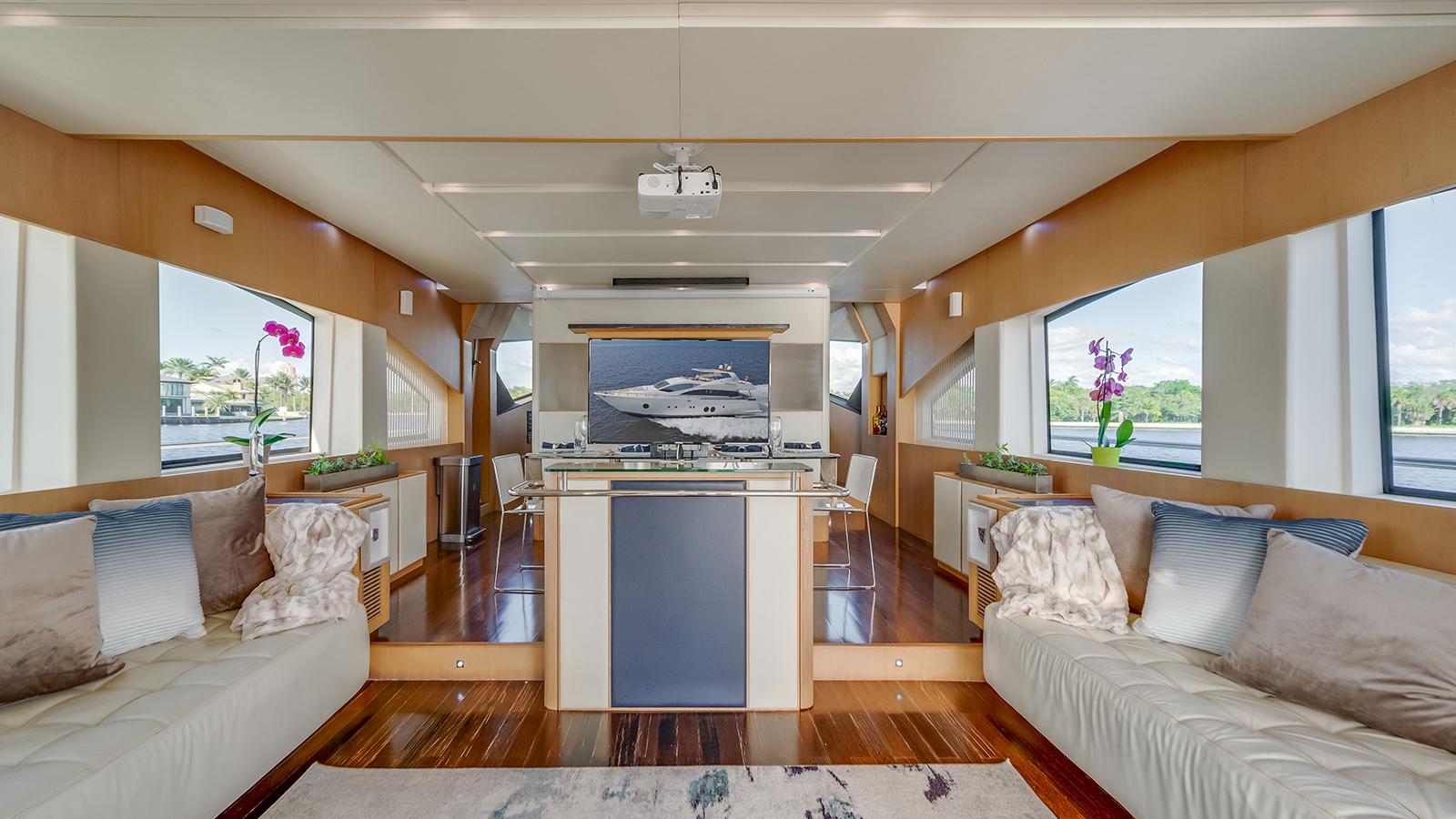 Aicon 75 luxury main salon with projector screen Miami yacht charter